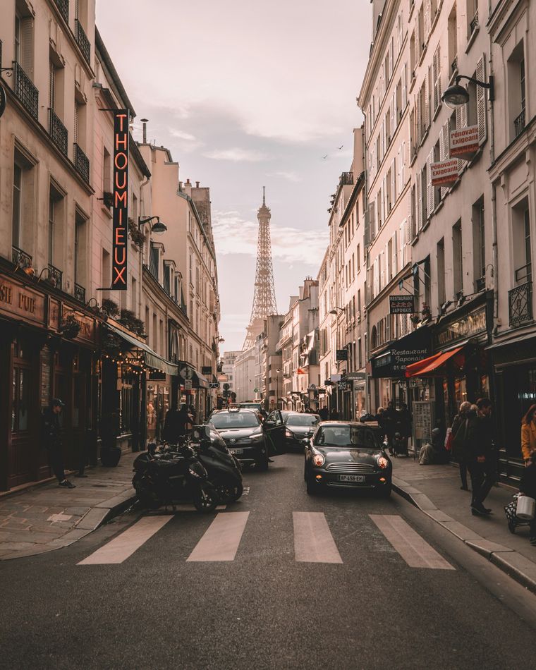 View of a Parisian street with the Eiffel tower in the background