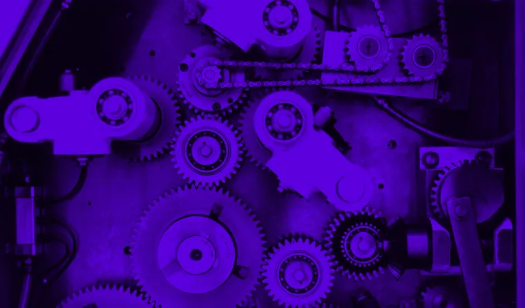 Close-up of interlocking gears and chains.